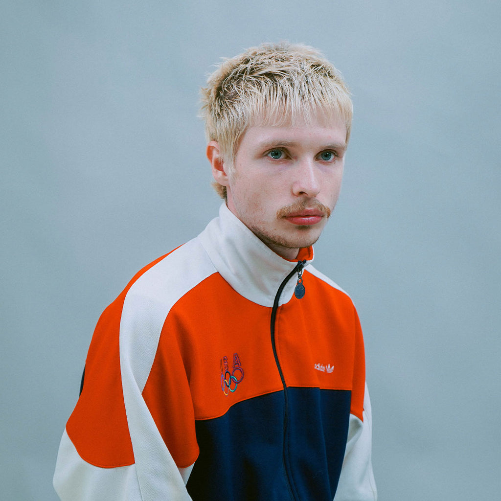 Model with bleached textured haircut styled with Ceremony Substance Shaping Clay, showcasing hold, definition, and styling finish