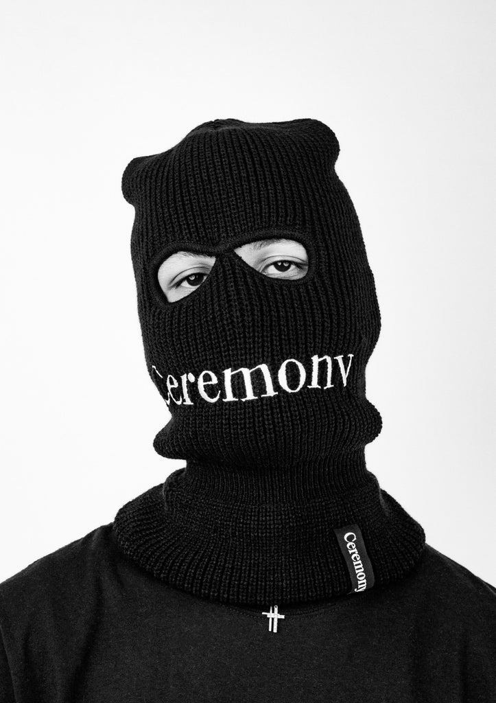 Black and white Photo of Ceremony Black Balaclava on Person From Front View featuring embroidered Ceremony Logo
